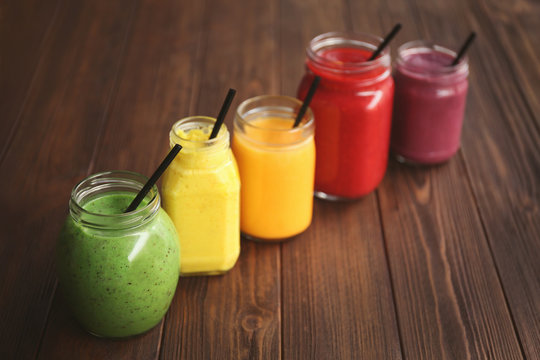 Refreshing fruit smoothie on table