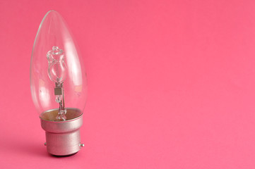 A light bulb isolated on a pink background
