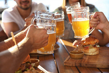 Group of friends drinking beer outdoors