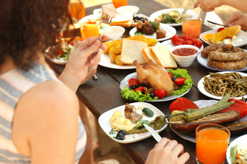 Friends eating on picnic