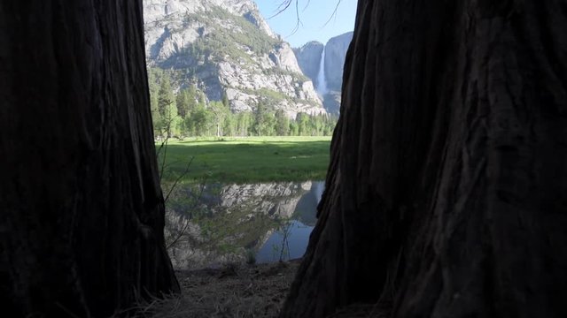 Yosemite Falls reflection in Merced River at Sunrise National Park, California