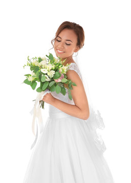 Beautiful bride with wedding bouquet isolated on white