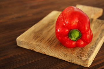Fresh pepper on a wooden cutting  board