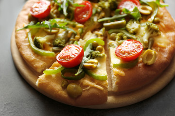 Plate with tasty vegetarian pizza on table