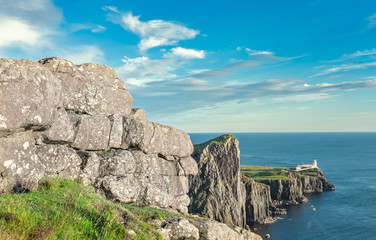 Fototapeta na wymiar Scotish Lighthouse on Cliffs in the Isle of Skye