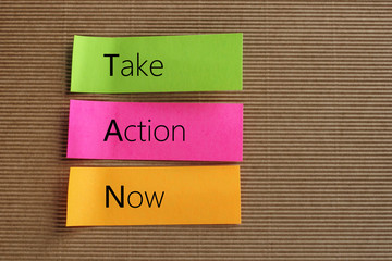 Take Action Now text on colorful sticky notes