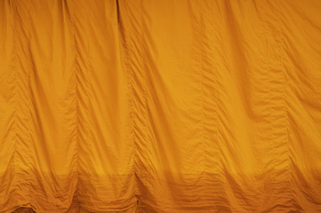 Yellow robe (of a Buddhist monk or novice); any of the three garments of the monk.
The upper inner robe.
Sarong, Sanghati, Antarvāsa