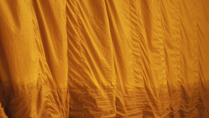 Yellow robe (of a Buddhist monk or novice); any of the three garments of the monk.
The upper inner robe.
Sarong, Sanghati, Antarvāsa