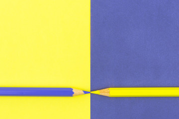 Yellow and Violet coloured pencils and paper
