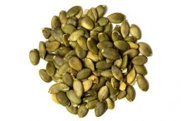 Shelled pumpkin seed isolated on white