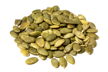 Shelled pumpkin seed isolated on white