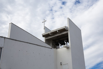 Rural old church cross with blue sky and cloud.