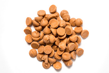 Butterscotch chips isolated on white