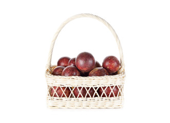 ripe passion fruit in white basket and on white background