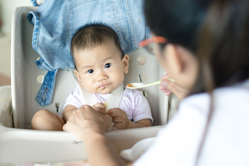 Asian baby feeding time