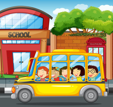 Children riding on yellow bus in town