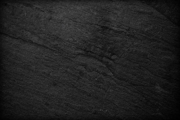 Dark grey black slate background or texture. © peekeedee