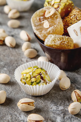 Eastern sweets. Turkish delight with pistachios in a vase. Dark