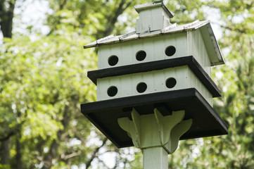 White painted wooden two storey bird house