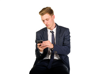 Young businessman sitting and watching to smart phone
