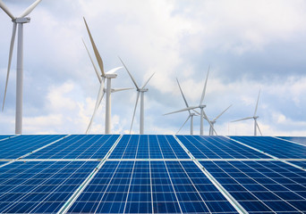 solar panels and wind turbines with the clouds and sky