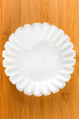 Coffee filters isolated on wood background