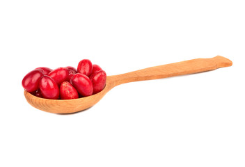 Cornelian cherries in spoon