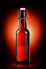 Swing top bottle of light beer isolated on black background