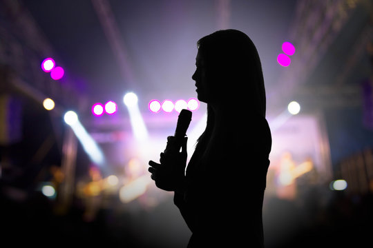 silhouette of female singer