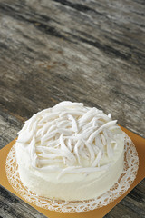 Coconut cake on wood plate