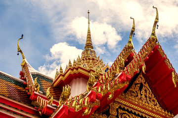 Fototapeta premium Thailand temple on a cloudy sky with the sun.