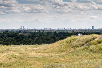 Fototapeta premium couple is sitting and watching the view of berlin