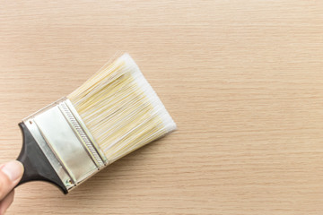 Paint brush on wood background