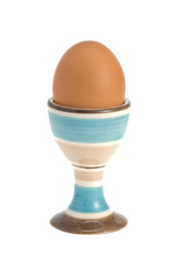 egg in egg cup isolated on white