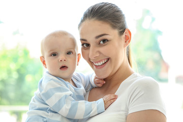 Mother and baby on light background