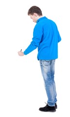 Fototapeta premium back view of writing business man. Curly boy in the blue jacket writes below.