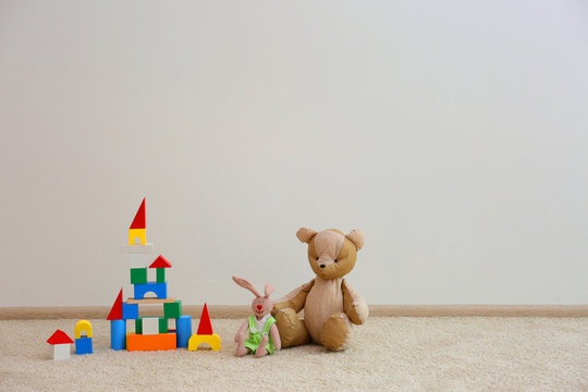 Beautiful toys on white wall background