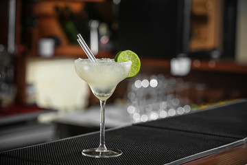 Cocktail in glass on bar counter