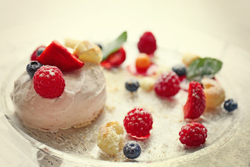 Ice cream with berries and mint leaves on plate