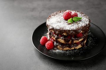 Tasty raspberry cake on grey background