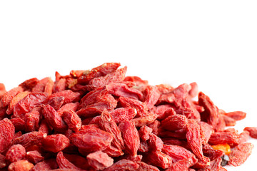 Obraz premium Heap of dried goji berries on white background