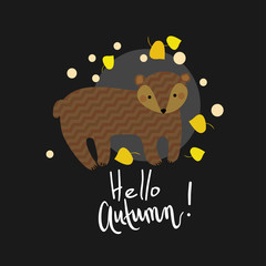 Cute kids spring illustration. Bear with yellow and orange falling leaves on natural dark grey chevron background. "Hello, Autumn" hand written lettering.