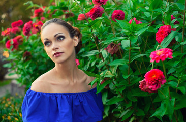 beautiful young woman in a flower garden
