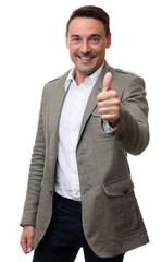 Smiling businessman showing his thumb up.