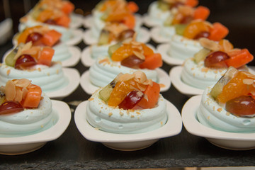  merangue topped with mixed fruit