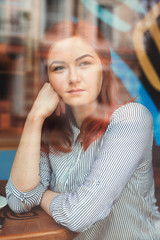 Young Attractive Woman in Cafe