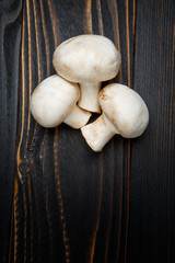 champignon mushroom on wooden background