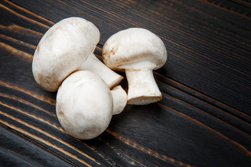 champignon mushroom on wooden background