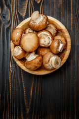 champignon mushroom on wooden background