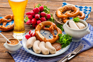 White sausages with sweet mustard and pretzel. Oktoberfest menu
